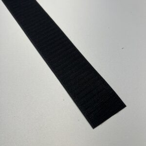 A black strip of rubber on top of a table.