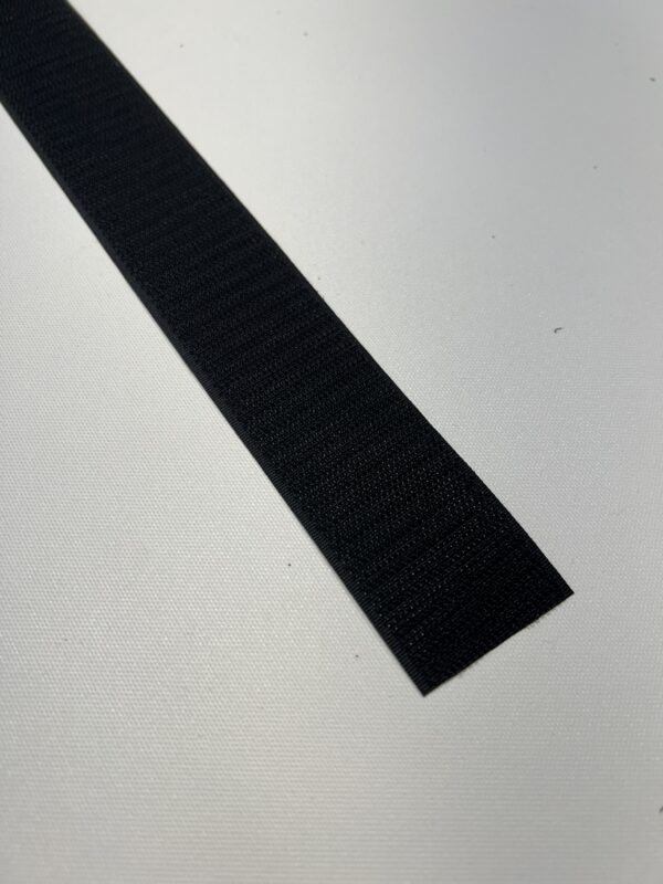 A black strip of rubber on top of a table.