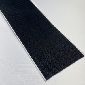 A black strip of paper on top of a table.