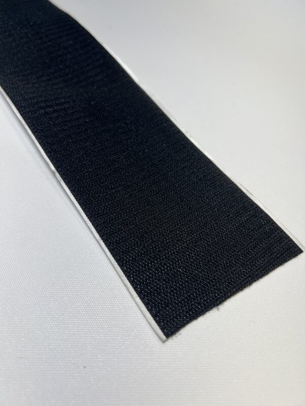 A black strip of paper on top of a table.