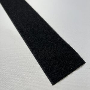 A black strip of rubber on top of a table.