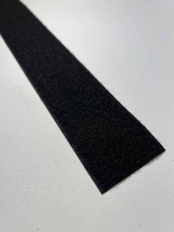 A black strip of rubber on top of a table.